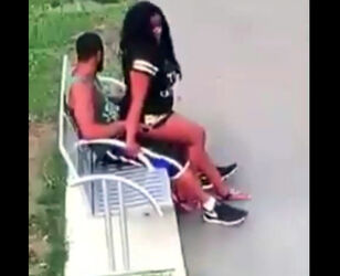 Ebony duo pulverizes on park bench not knowing that they are